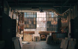 Image of a variety of art being stored in an industrial style building