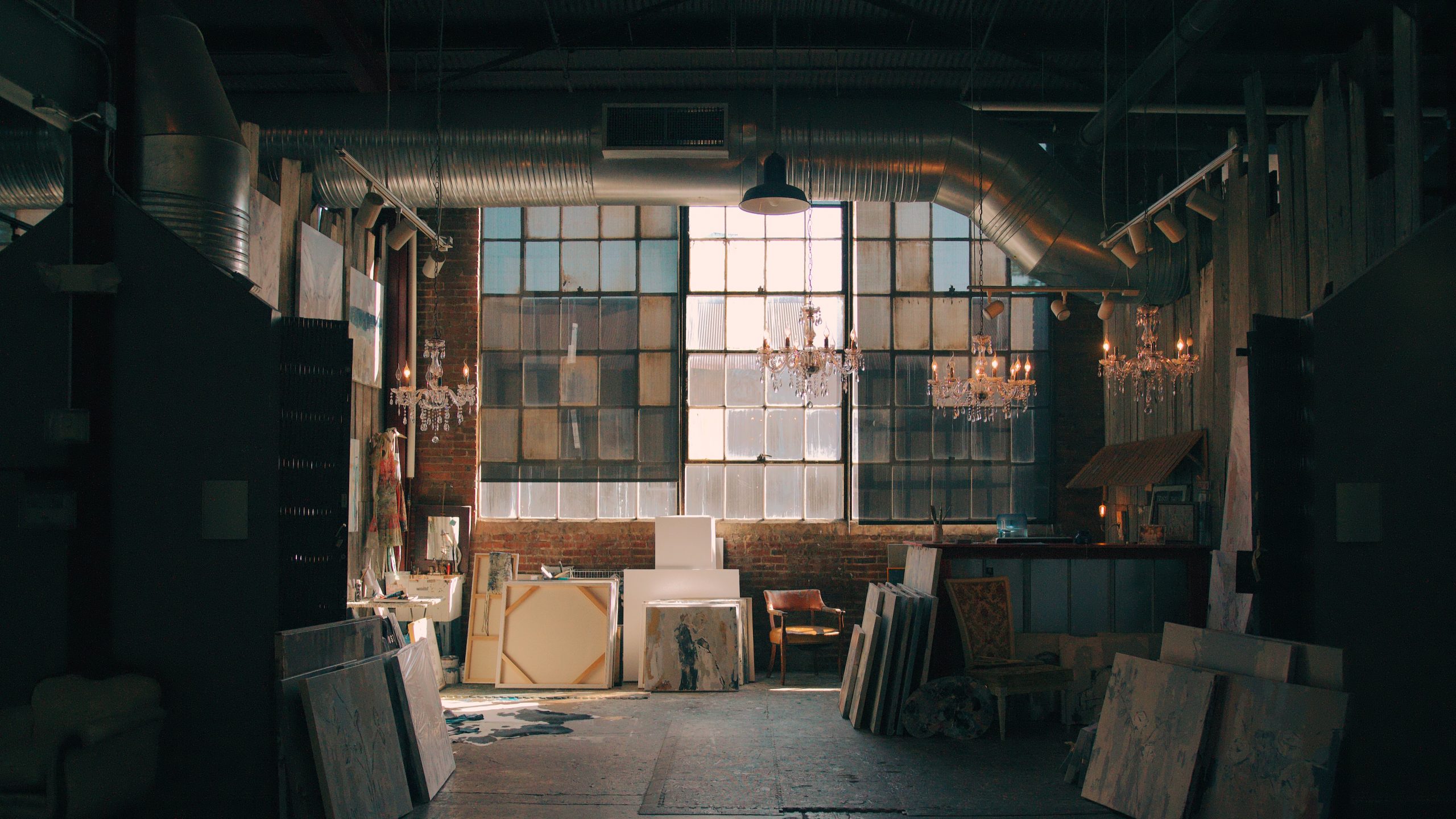 Image of a variety of art being stored in an industrial style building
