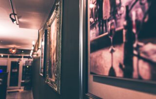 image of an art exhibition or gallery in the dark for blog post how much does it cost to transport art?