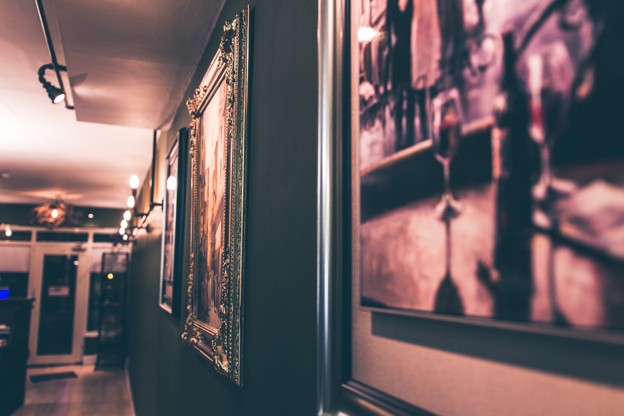 image of an art exhibition or gallery in the dark for blog post how much does it cost to transport art?