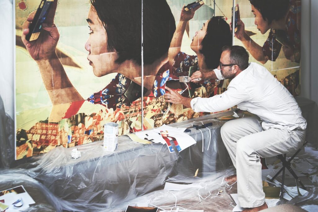 an image of an artist working on a large piece