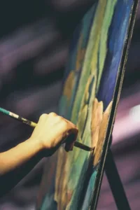image of artist painting for blog How Hiring Fine Art Shippers Secures Your Art's Future