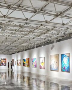 Image of painitings hung in an art gallery for the blog What Service Should I Use When Shipping Paintings?