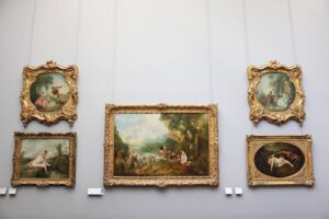 Image of paintings hung in a gallery for the blog Why Shipping Paintings Isn’t As Simple As It Seems